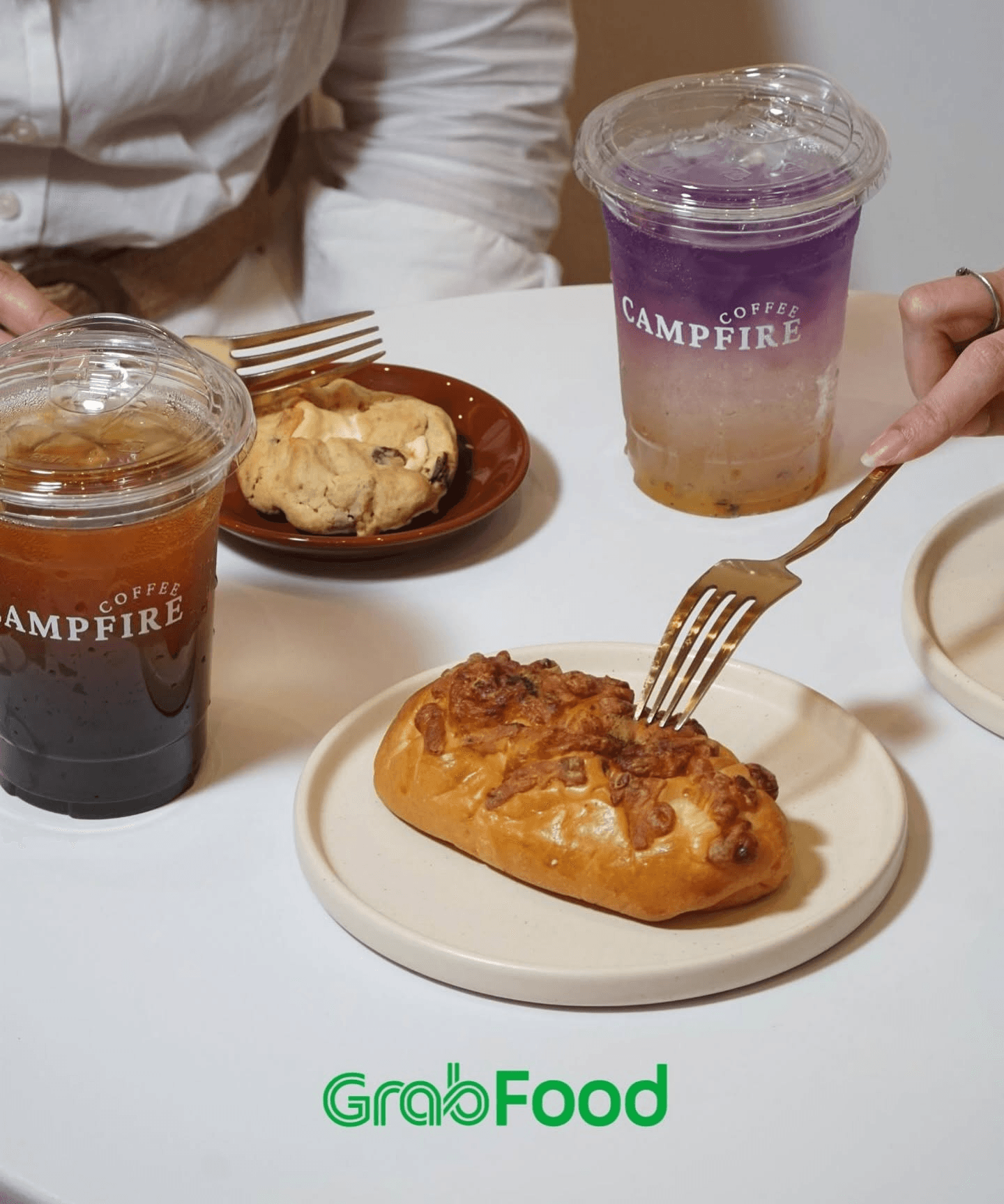Colorful drinks and pastries shared around a table